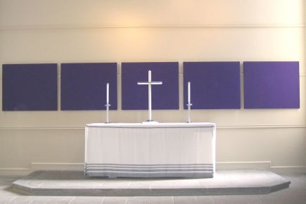 A series of rectangular squares covered in purple fabric.