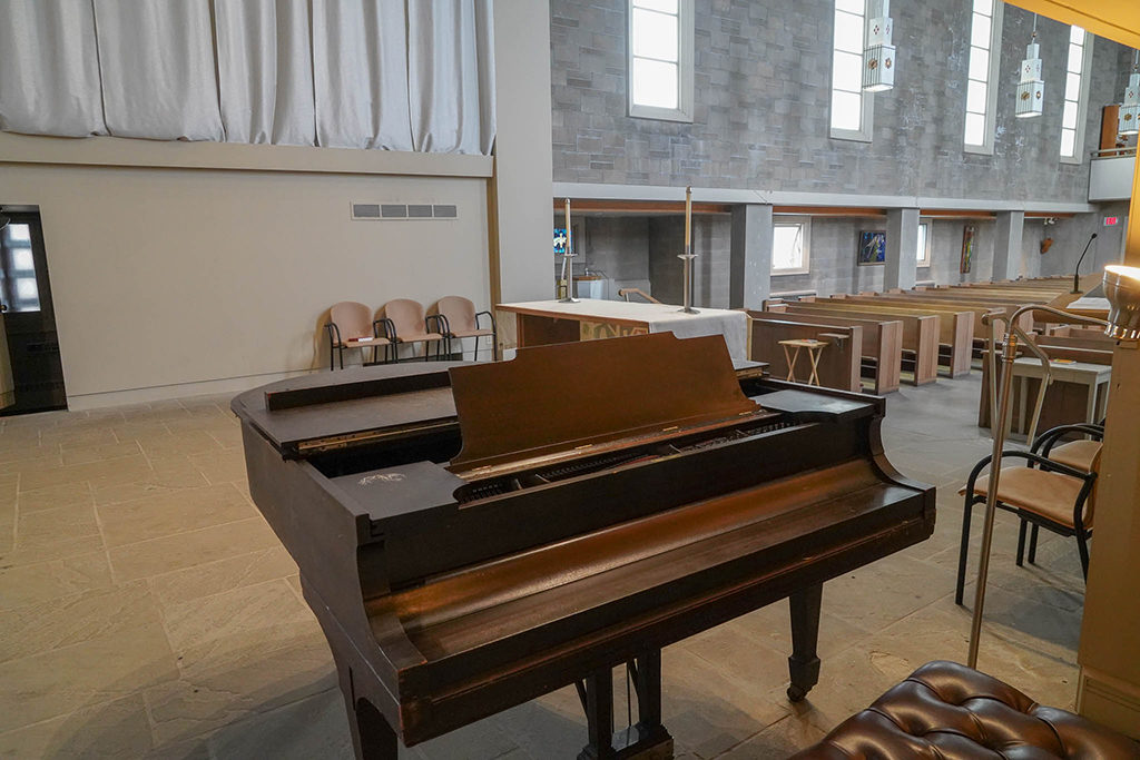 View from the bench of a grand piano in the University Lutheran Church sanctuary