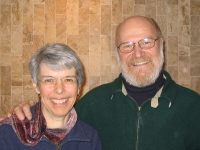 A smiling Cynthia Rosenberger and Paul Hanson pose in the narthex of University Lutheran Church.
